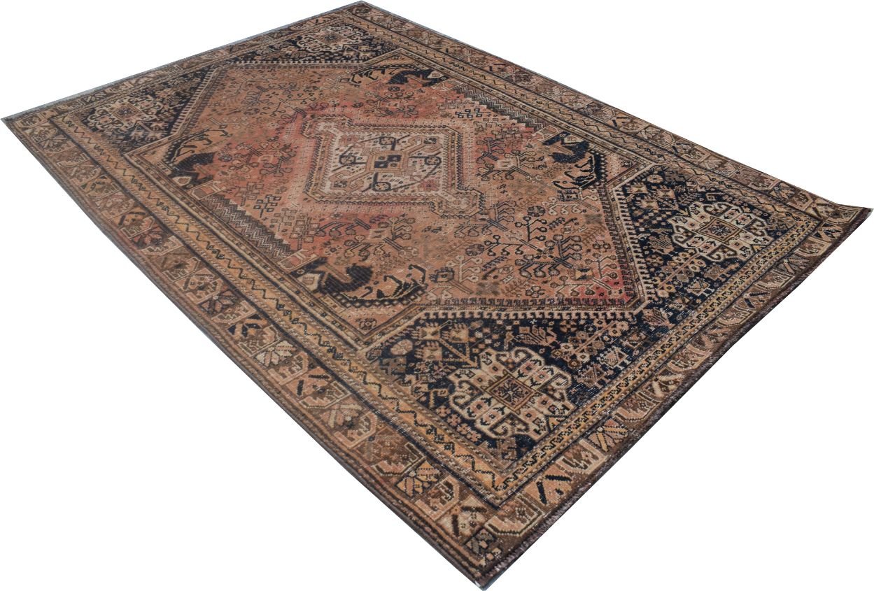 A rectangular handmade Persian wool rug featuring a traditional tribal pattern in rust and navy.