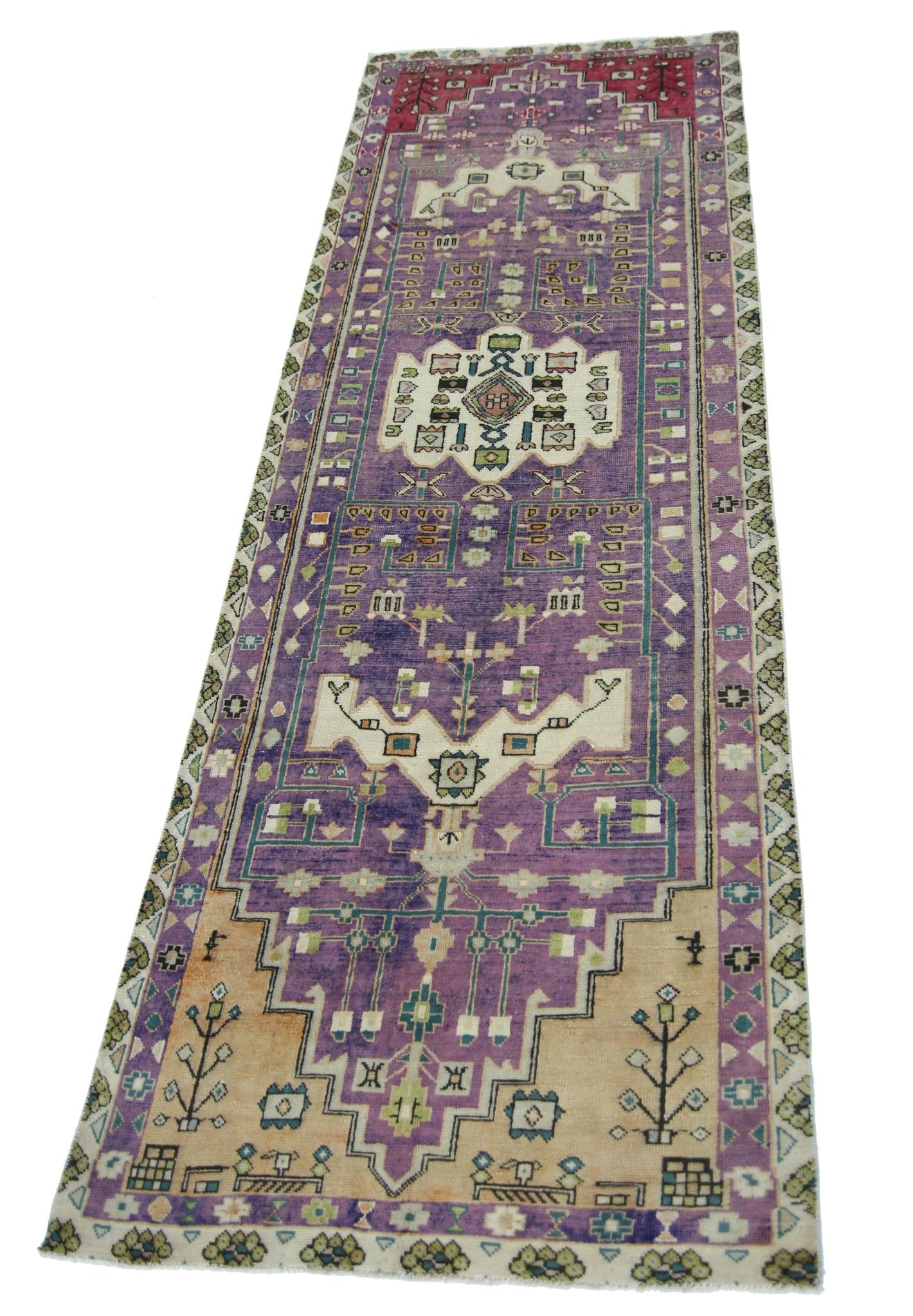 A vintage handmade Persian runner rug featuring a purple and tan geometric pattern.