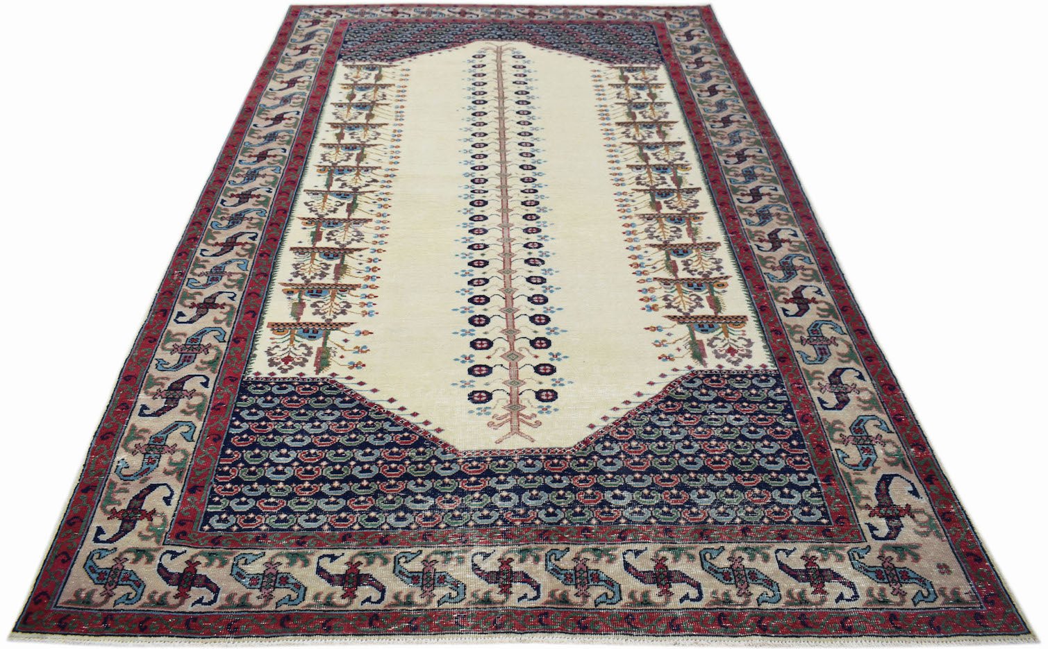 A vintage handwoven Persian rug featuring a central tree motif on a cream field with ornate borders.