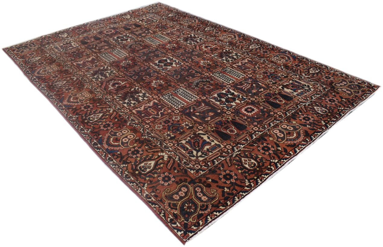 A rectangular vintage Persian rug featuring a multi-colored geometric patchwork pattern.