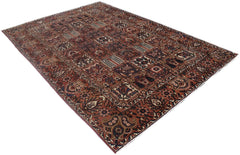 A rectangular vintage Persian rug featuring a multi-colored geometric patchwork pattern.
