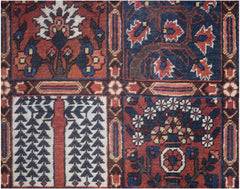 A vintage Persian rug featuring a geometric grid pattern with floral and tree motifs.