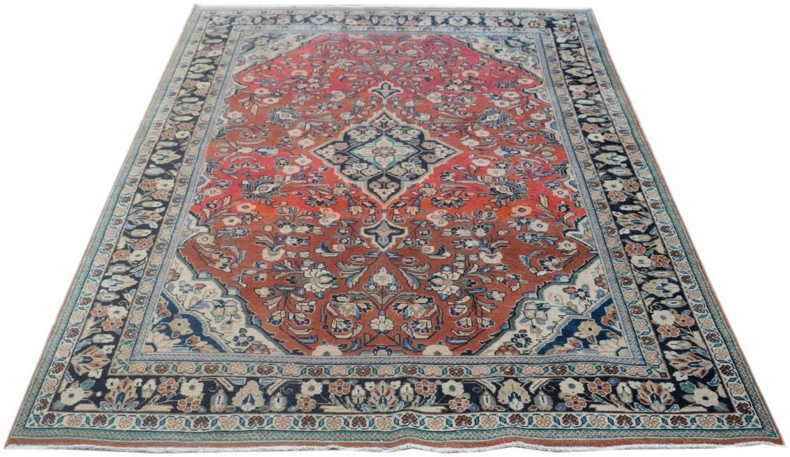 A vintage Persian rug featuring a central medallion and floral patterns in red and blue tones.