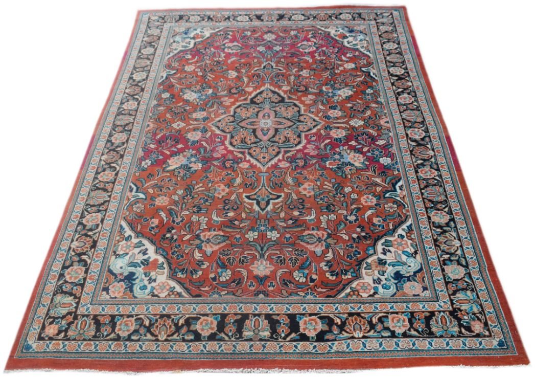 A rectangular vintage Persian rug featuring a central floral medallion on a red field.