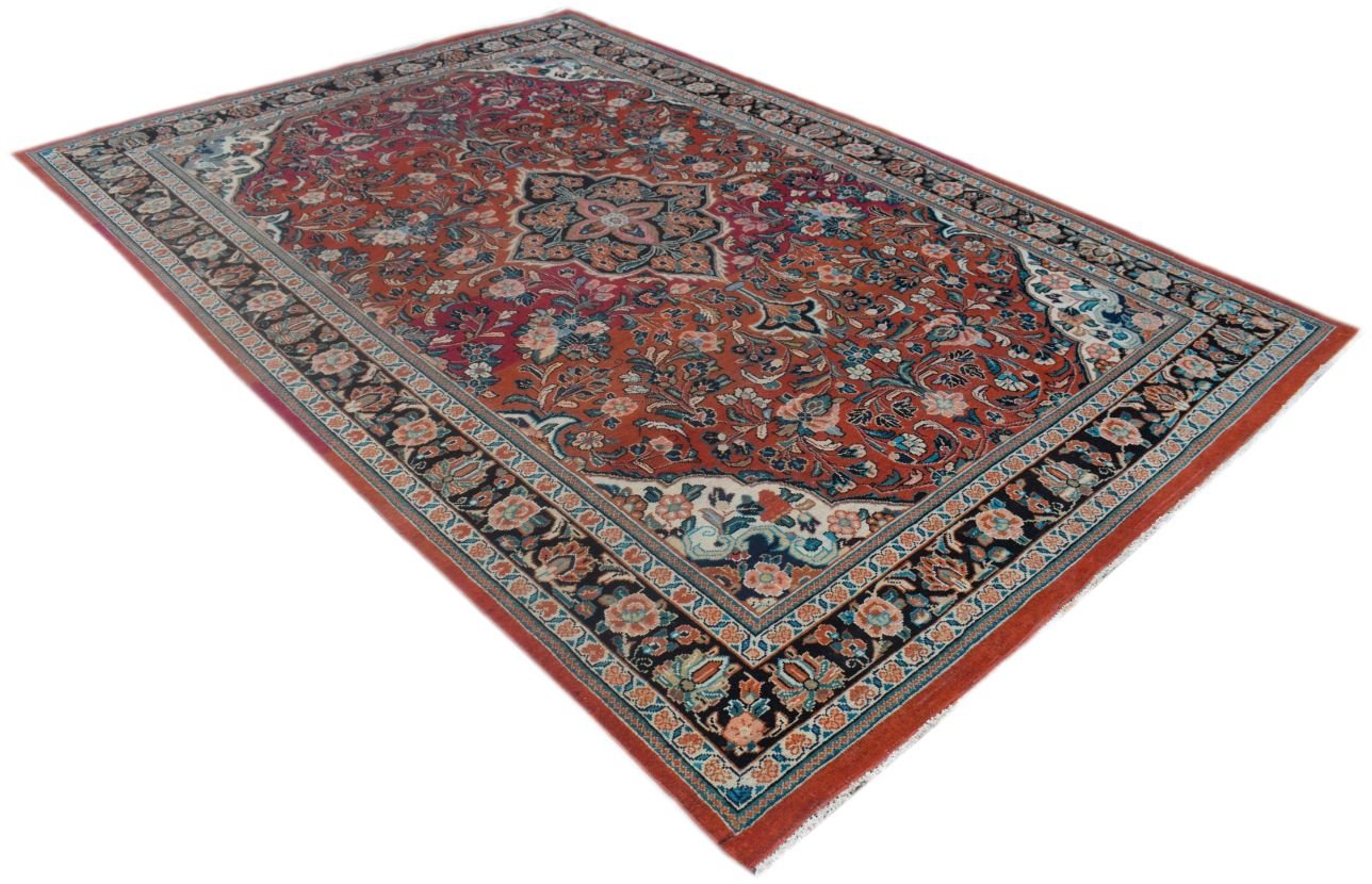 A rectangular vintage Persian rug featuring a floral pattern in red, blue, and cream tones.