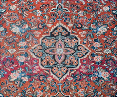 A vintage Persian rug featuring a central floral medallion on a red field with intricate patterns.