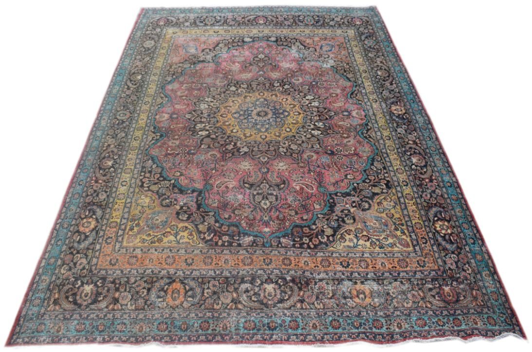A rectangular vintage Persian rug featuring a central medallion with intricate floral patterns.