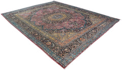 A large, handmade vintage Persian wool rug featuring a central medallion and intricate floral motifs.