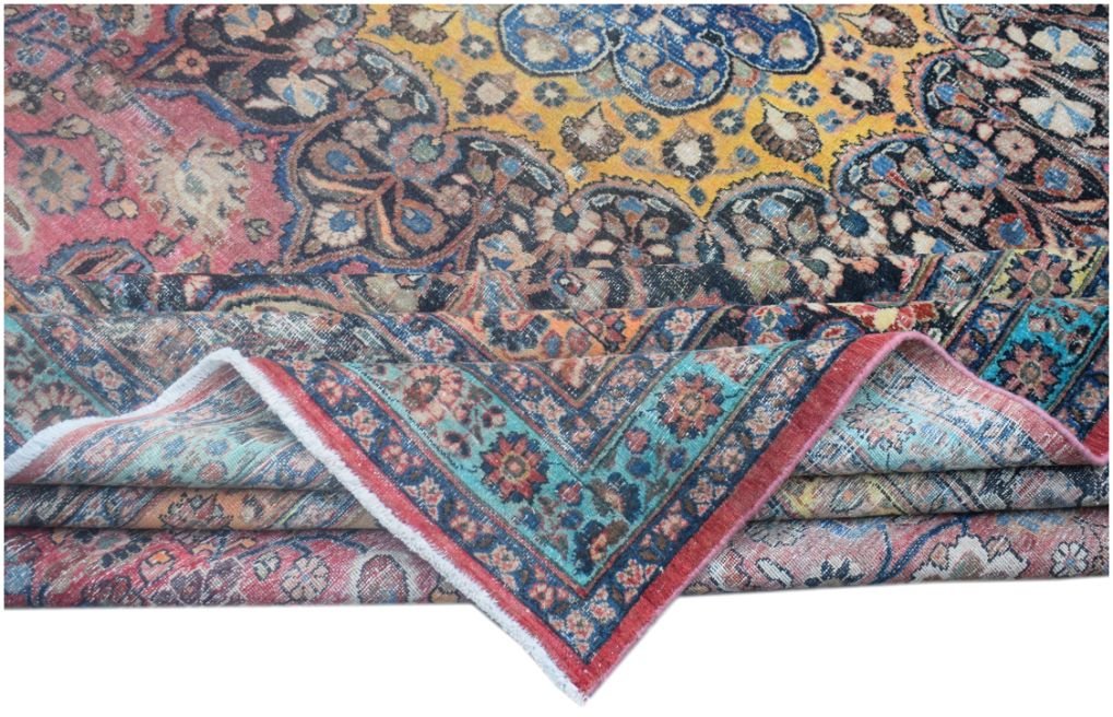 A vintage handmade Persian wool rug featuring a vibrant floral pattern in yellow, red, and blue.