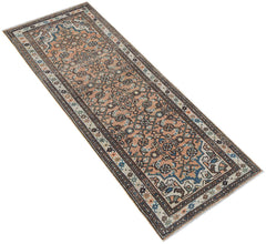 Vintage Persian runner with a peach field and intricate geometric patterns.