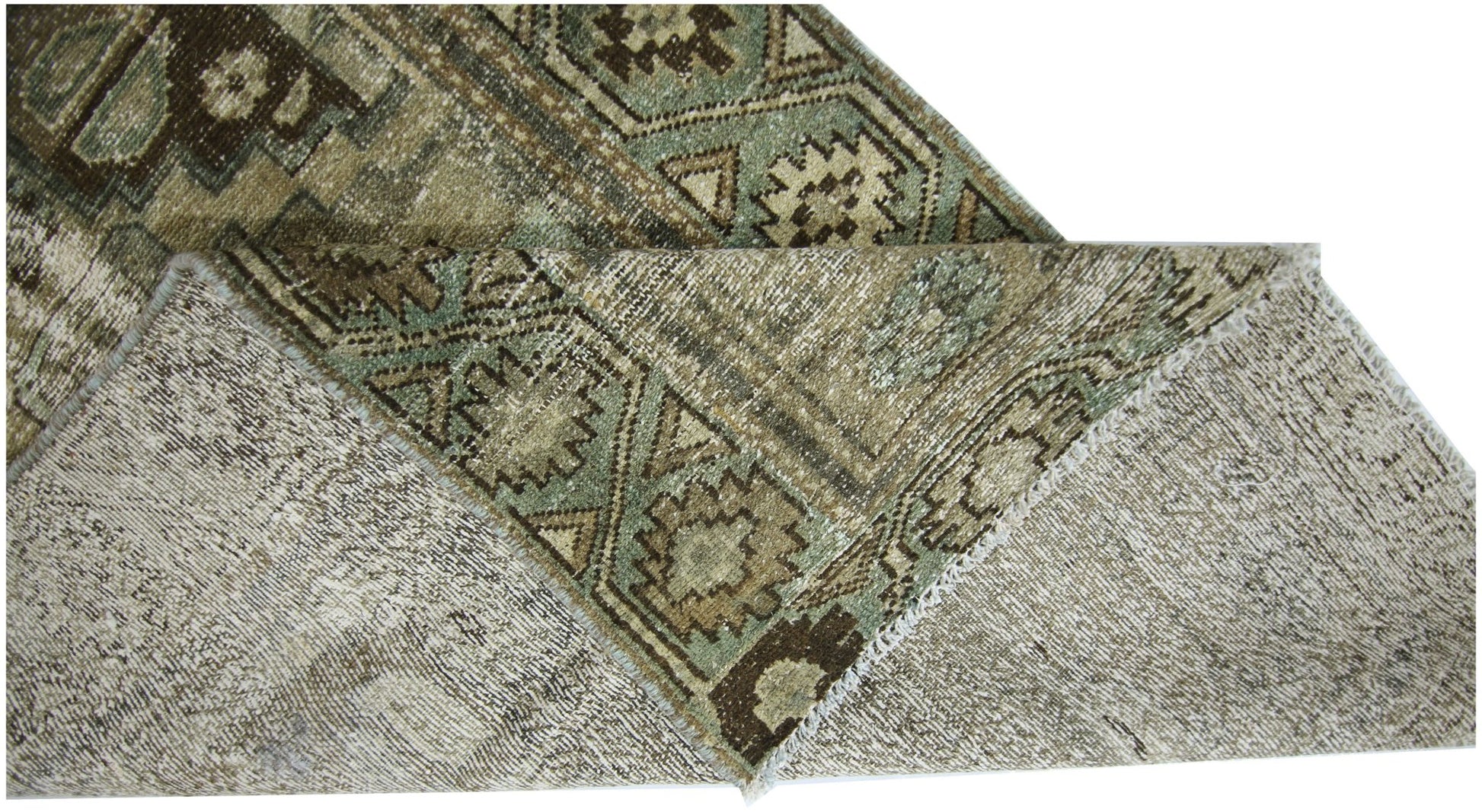 A vintage Persian runner with a geometric pattern in shades of brown and green.
