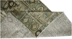 A vintage Persian runner with a geometric pattern in shades of brown and green.