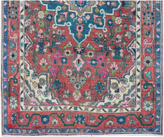 A handmade vintage Persian runner featuring a floral pattern in red, blue, and cream tones.