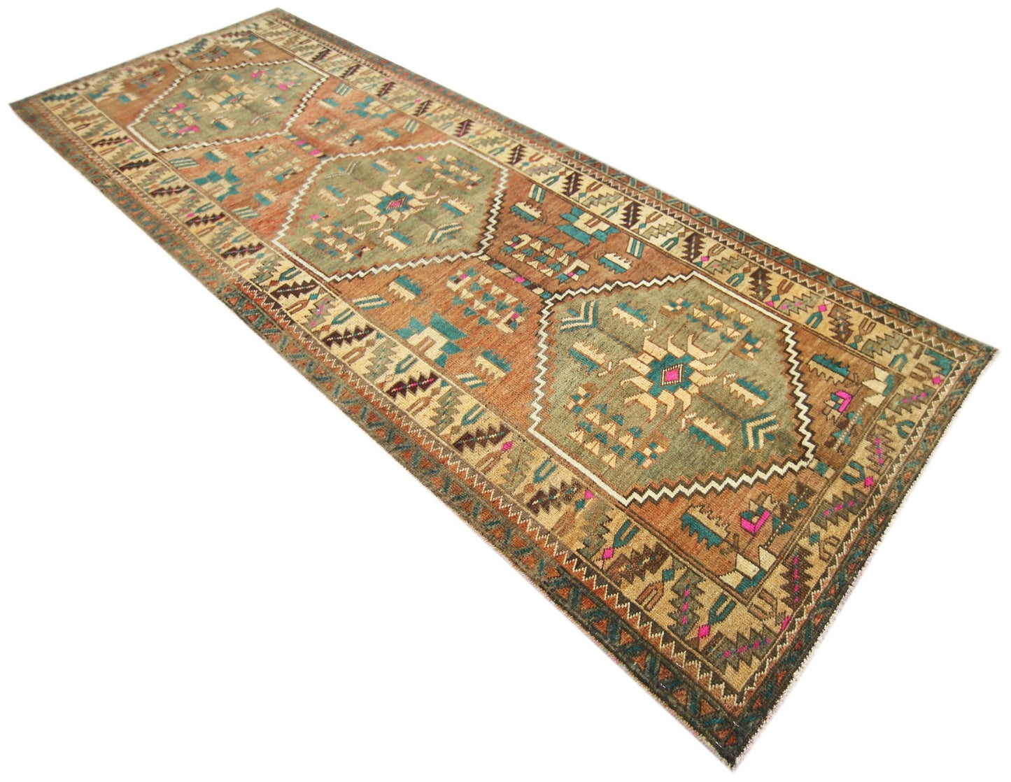 A vintage Persian runner rug featuring geometric medallions in earthy tones on a wool pile.
