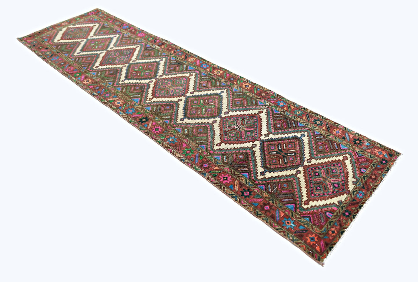 A vintage Persian runner featuring a repeating diamond pattern in vibrant, multicolored wool.