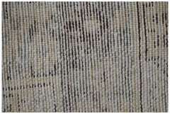 Close-up of a handwoven vintage Persian runner featuring a worn, textured wool pattern.