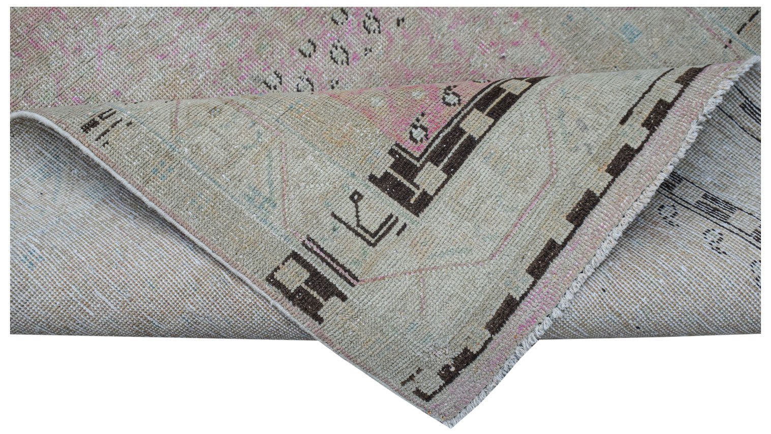 Vintage Persian runner rug with geometric patterns in brown and pink.