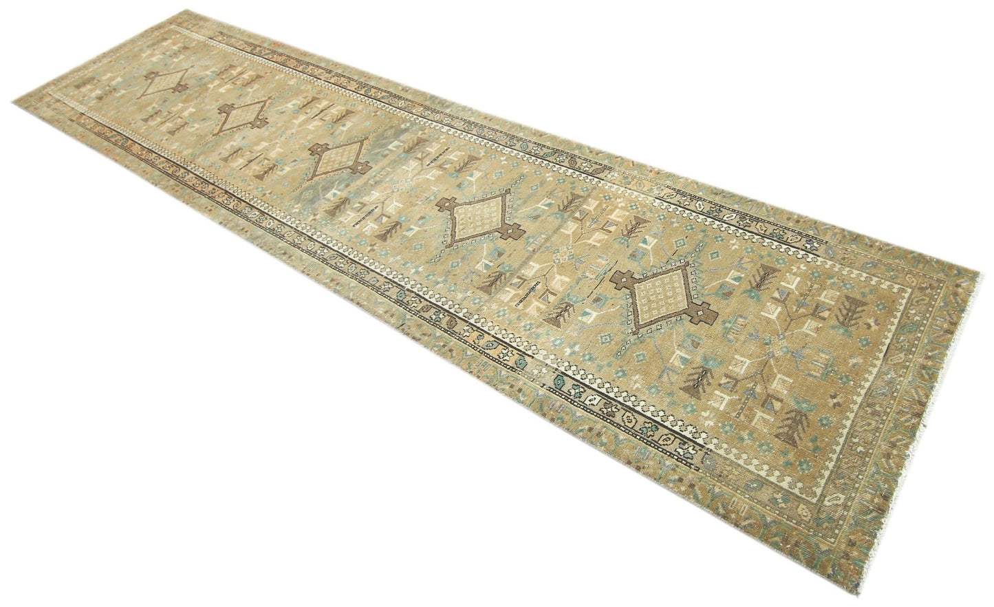 A long, handmade vintage Persian runner rug featuring geometric patterns in muted earth tones.