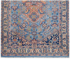 A vintage Persian runner featuring a geometric floral pattern in shades of blue, orange, and cream.