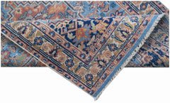 A handwoven vintage Persian runner featuring a traditional floral pattern in blue and orange tones.