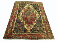 A vintage Persian Sanandaj rug featuring a central medallion on a dark field with red borders.
