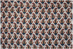 A vintage Persian Saraband rug featuring a repeating blue and red paisley pattern on a cream base.