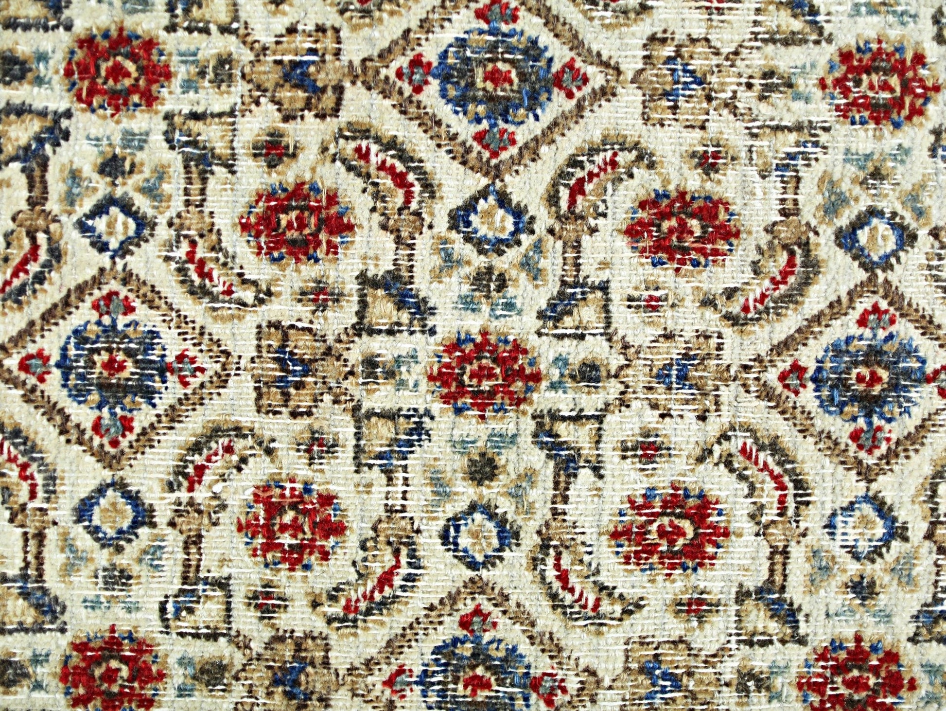 A vintage Persian Saraband rug featuring a repeating geometric pattern in red, blue, and tan.