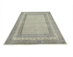 A vintage Persian Saraband rug featuring a repeating geometric pattern in neutral tones.