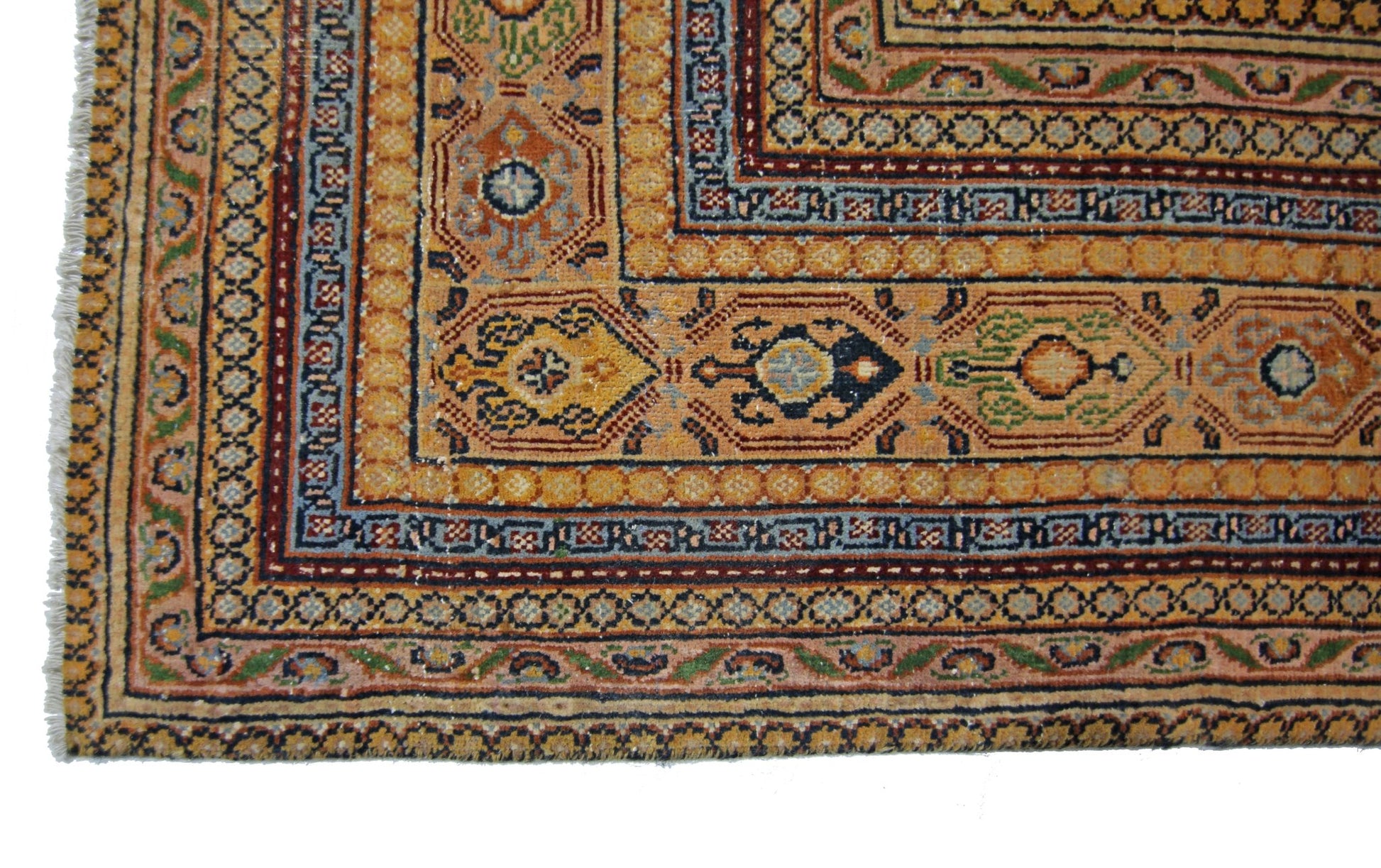 A vintage Persian Saraband rug featuring a geometric border and intricate floral patterns.