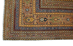 A vintage Persian Saraband rug featuring a geometric border and intricate floral patterns.