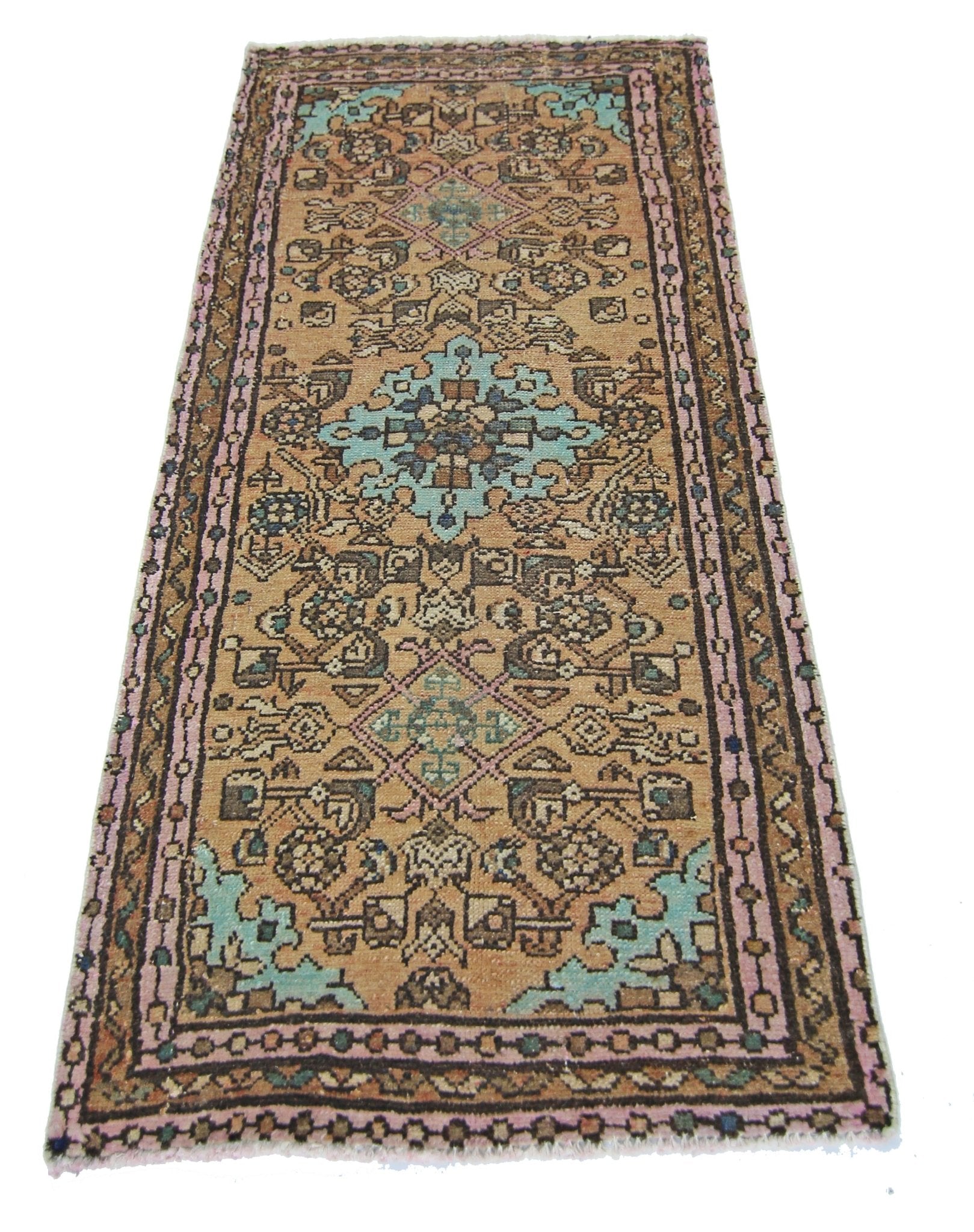 A vintage Persian runner rug featuring a geometric floral pattern in shades of tan, blue, and pink.