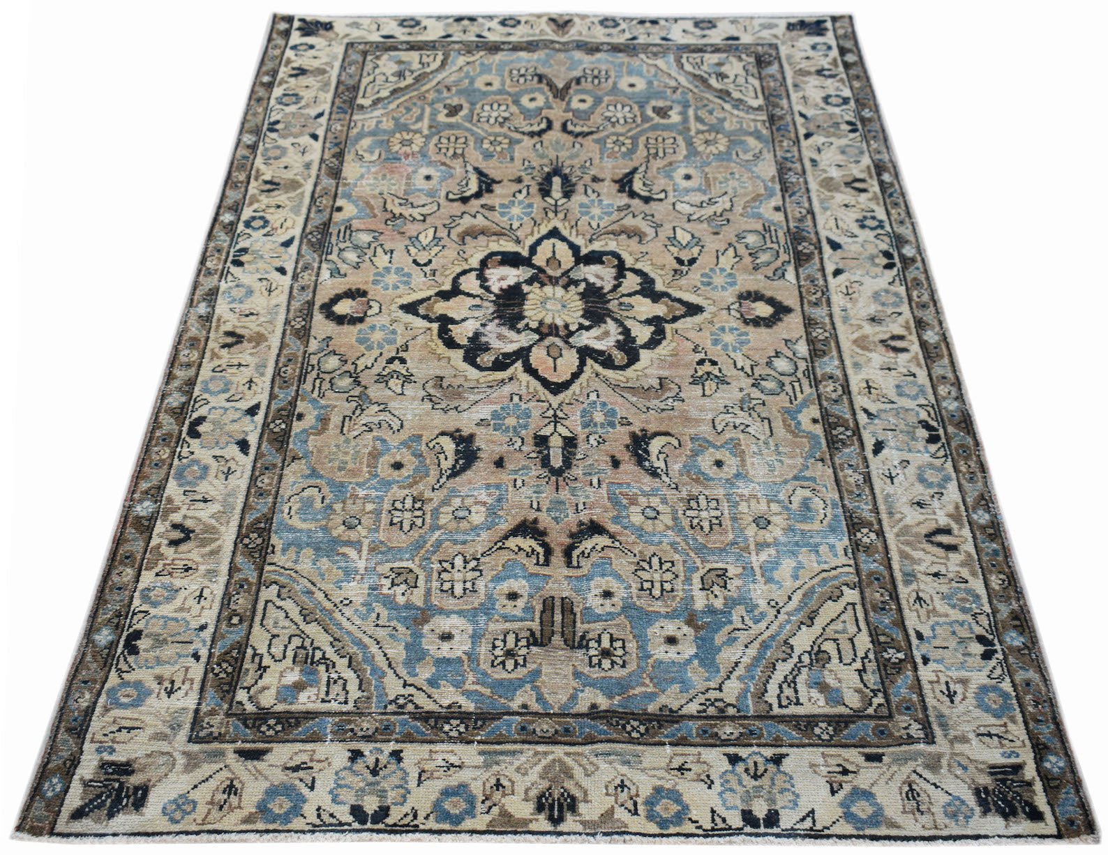 A vintage handwoven Persian Sarouk rug featuring a floral medallion in blue and beige tones.
