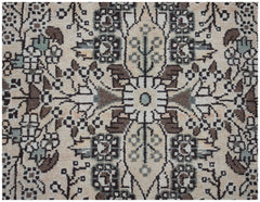 A vintage Persian Sarouk runner featuring a symmetrical floral pattern in cream, brown, and blue.
