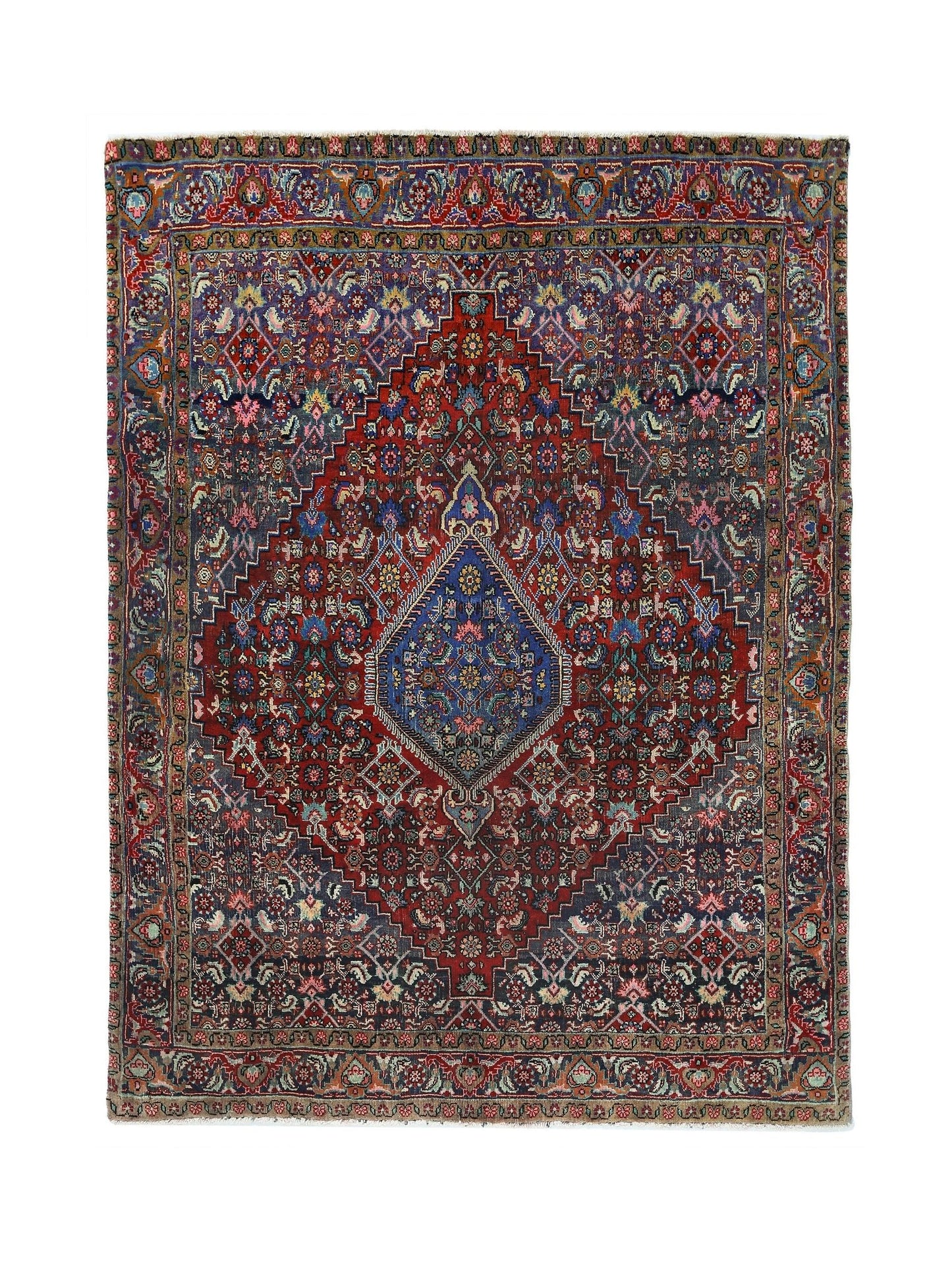 A vintage Persian Senneh rug featuring a central diamond medallion on a deep red and blue field.