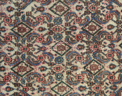 A vintage Persian Senneh runner featuring a detailed geometric pattern in wool on a cotton base.