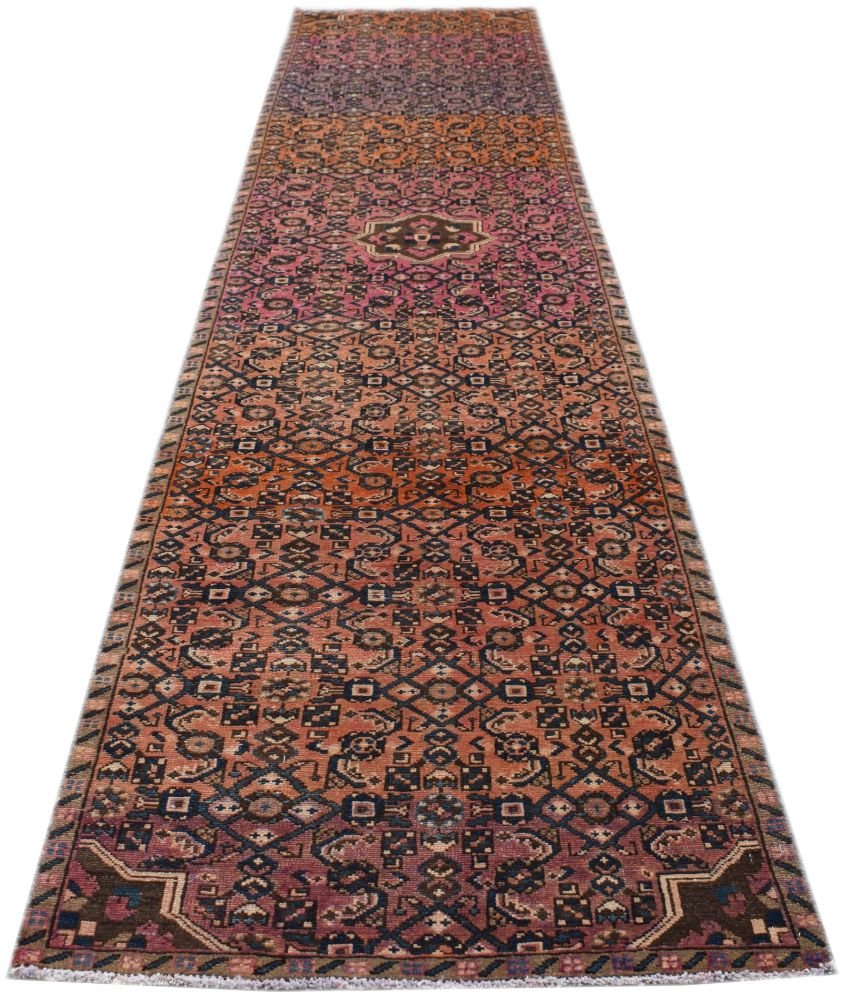 A handmade vintage Persian Senneh runner featuring a geometric pattern in shades of red and blue.