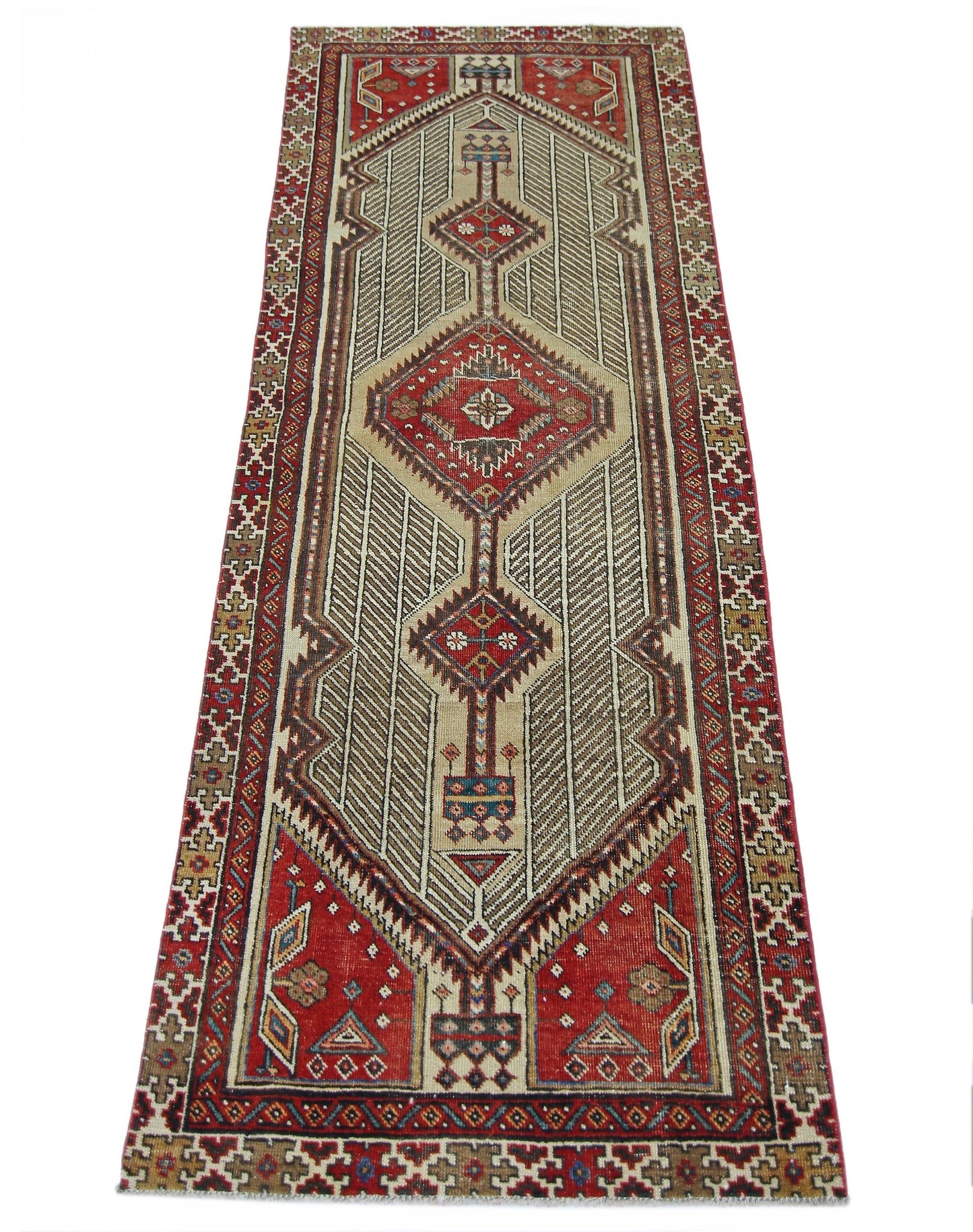 A vintage Persian Serab runner featuring a geometric diamond pattern in red and beige tones.