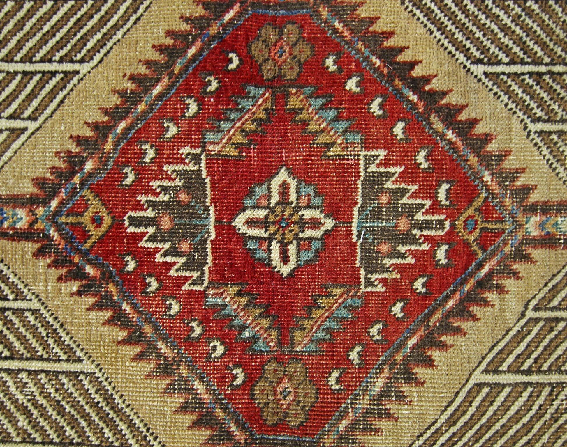 A vintage Persian Serab runner featuring a central diamond medallion with geometric floral motifs.