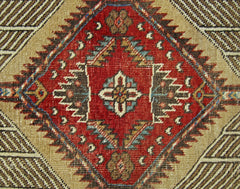 A vintage Persian Serab runner featuring a central diamond medallion with geometric floral motifs.