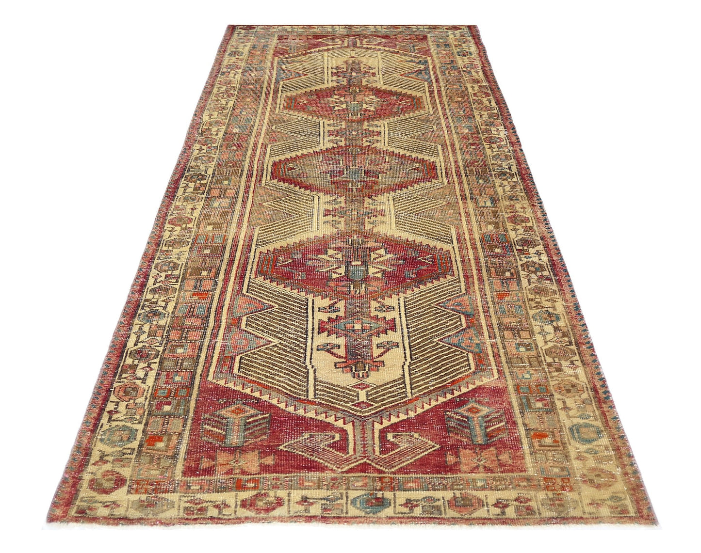 A vintage Persian Serab runner featuring a geometric medallion pattern in red and beige tones.