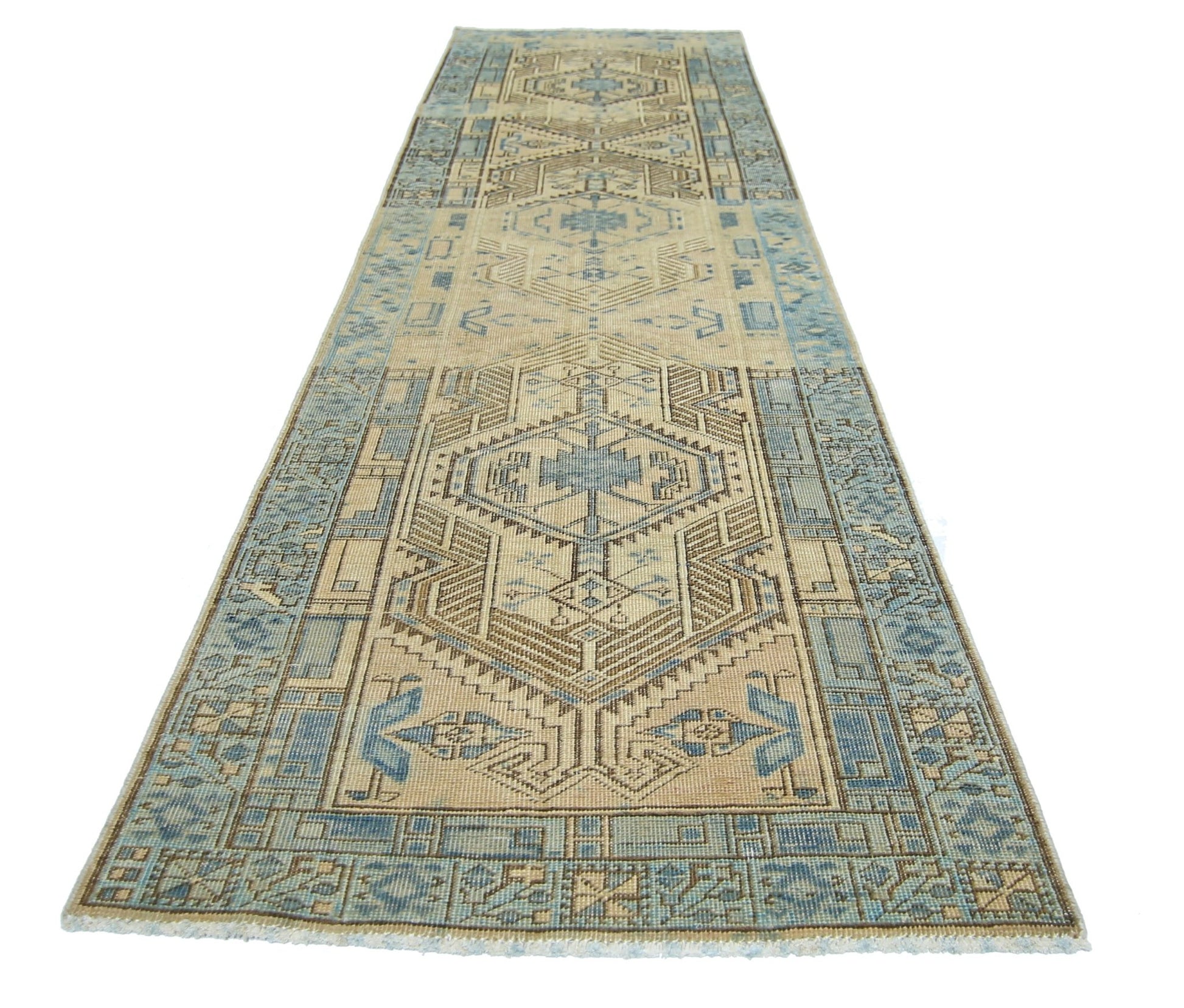 A vintage Persian Serab runner rug featuring geometric patterns in shades of blue and beige.