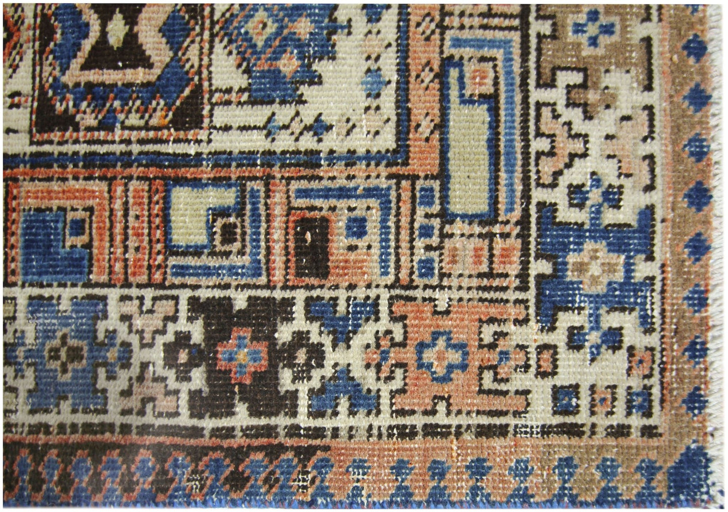 A vintage Persian Serab runner featuring geometric patterns in blue, orange, and cream wool.