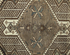 A vintage Persian Serab runner featuring a geometric diamond pattern in brown and cream tones.