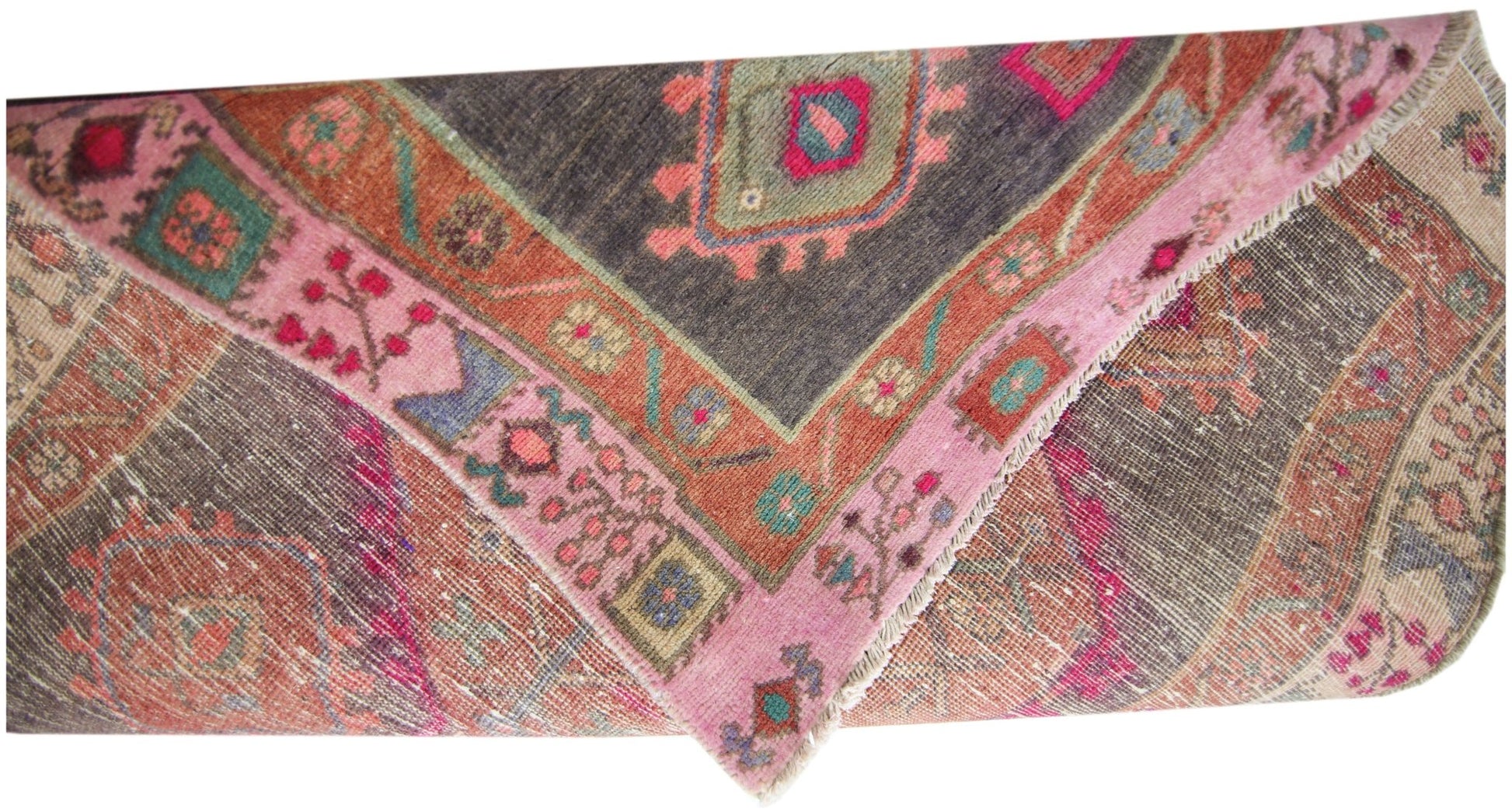 A vintage Persian Hamadan runner featuring a geometric pattern in pink, orange, and dark grey.