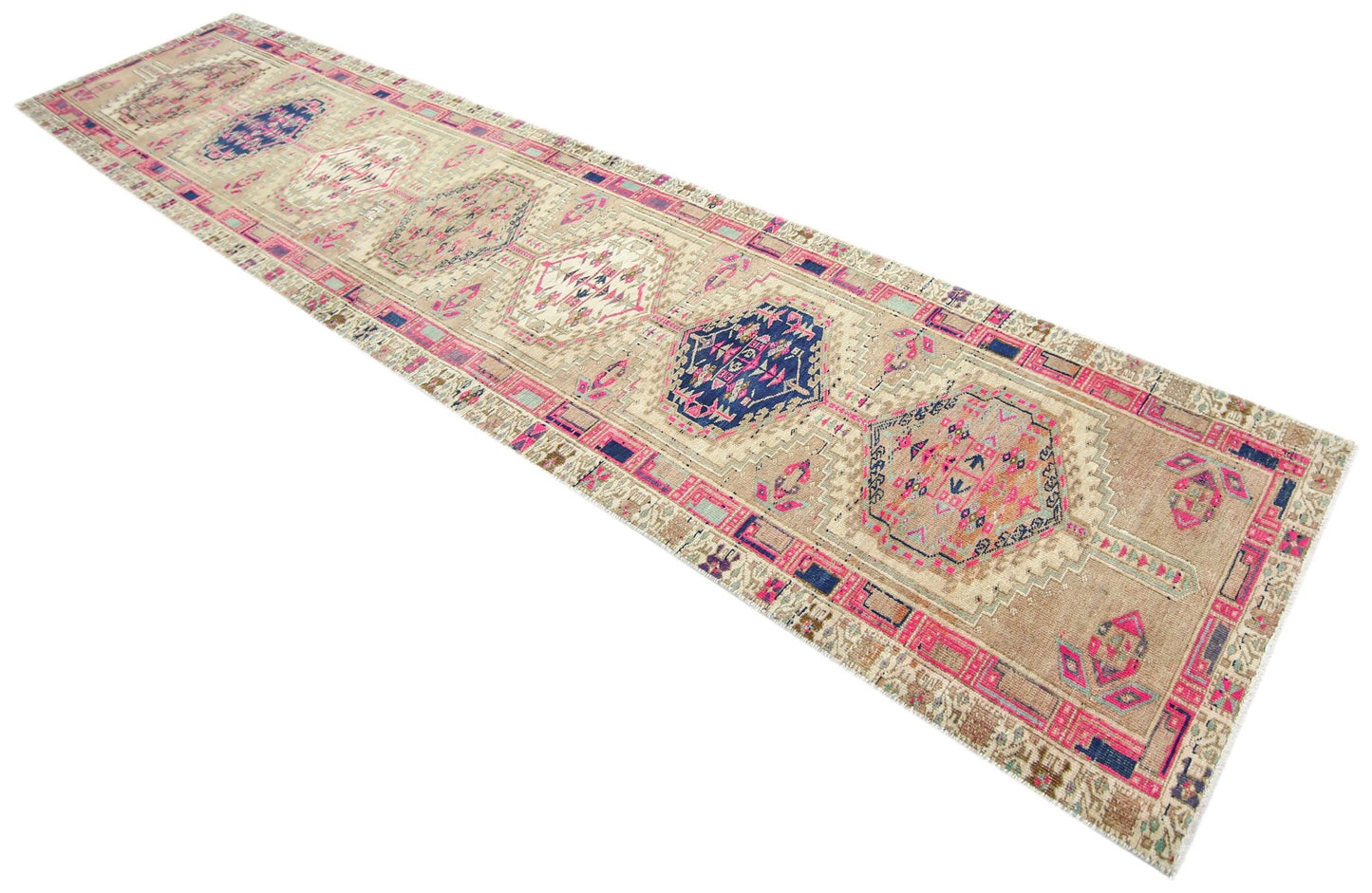 A vintage Persian Hamadan runner rug featuring geometric medallions in blue, pink, and beige.