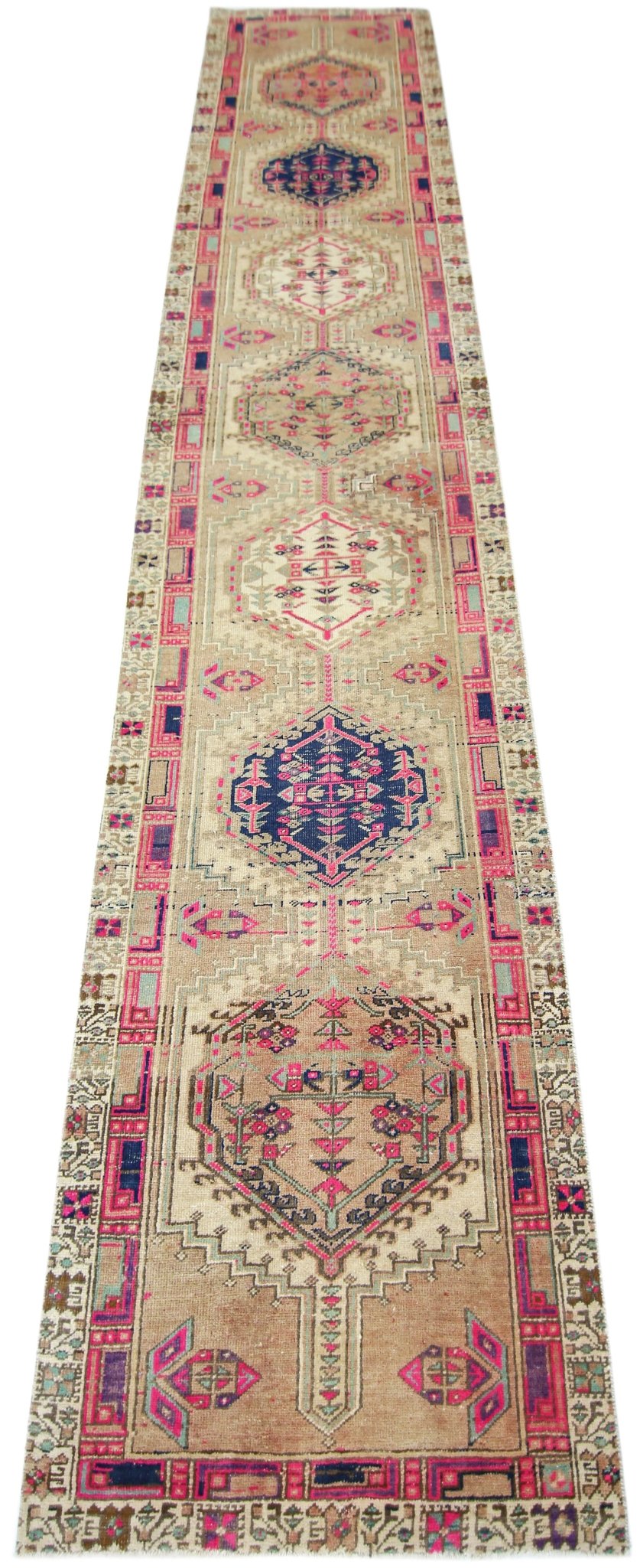 A vintage Persian Hamadan runner featuring geometric medallions in pink and blue on a tan field.