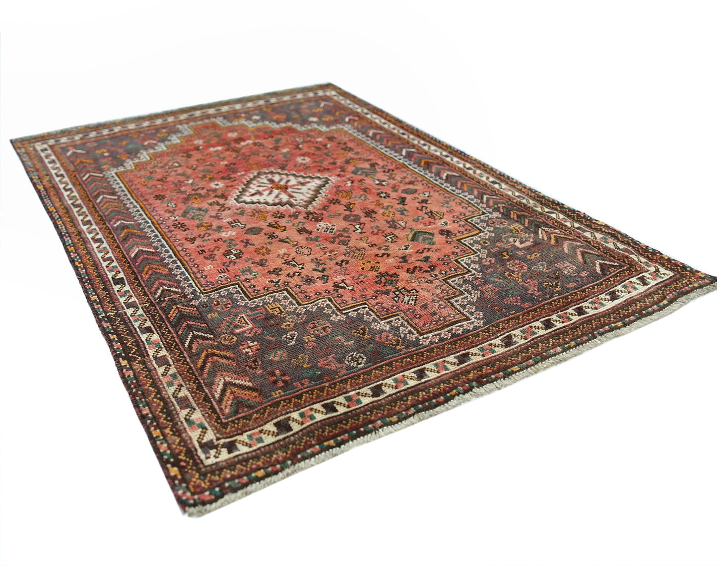 A handwoven vintage Persian Shiraz rug featuring a geometric pattern in red and dark brown tones.