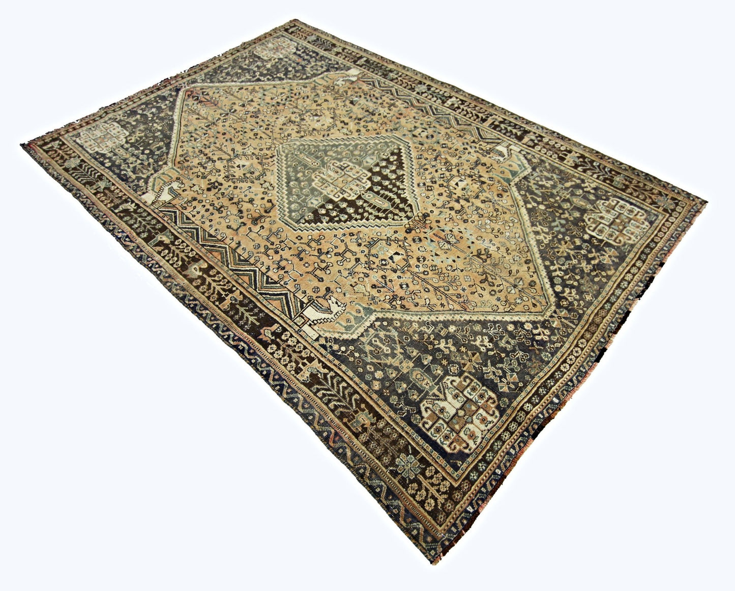 A vintage Persian Shiraz rug featuring a central geometric medallion on a tan and dark brown field.