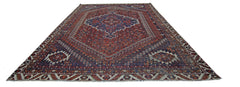 A vintage Persian Shiraz rug featuring a central medallion and intricate geometric patterns.