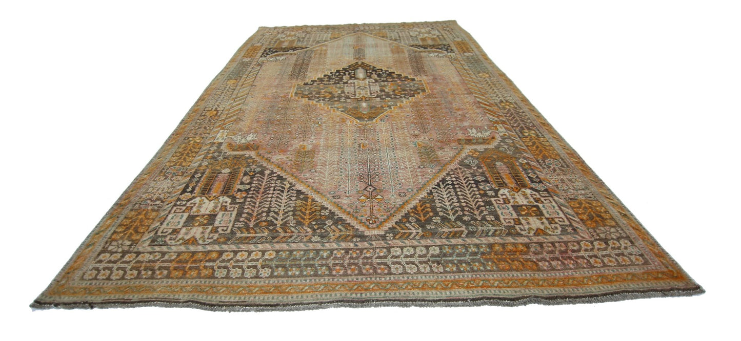 A vintage Persian Shiraz rug featuring a central diamond medallion and intricate geometric patterns.